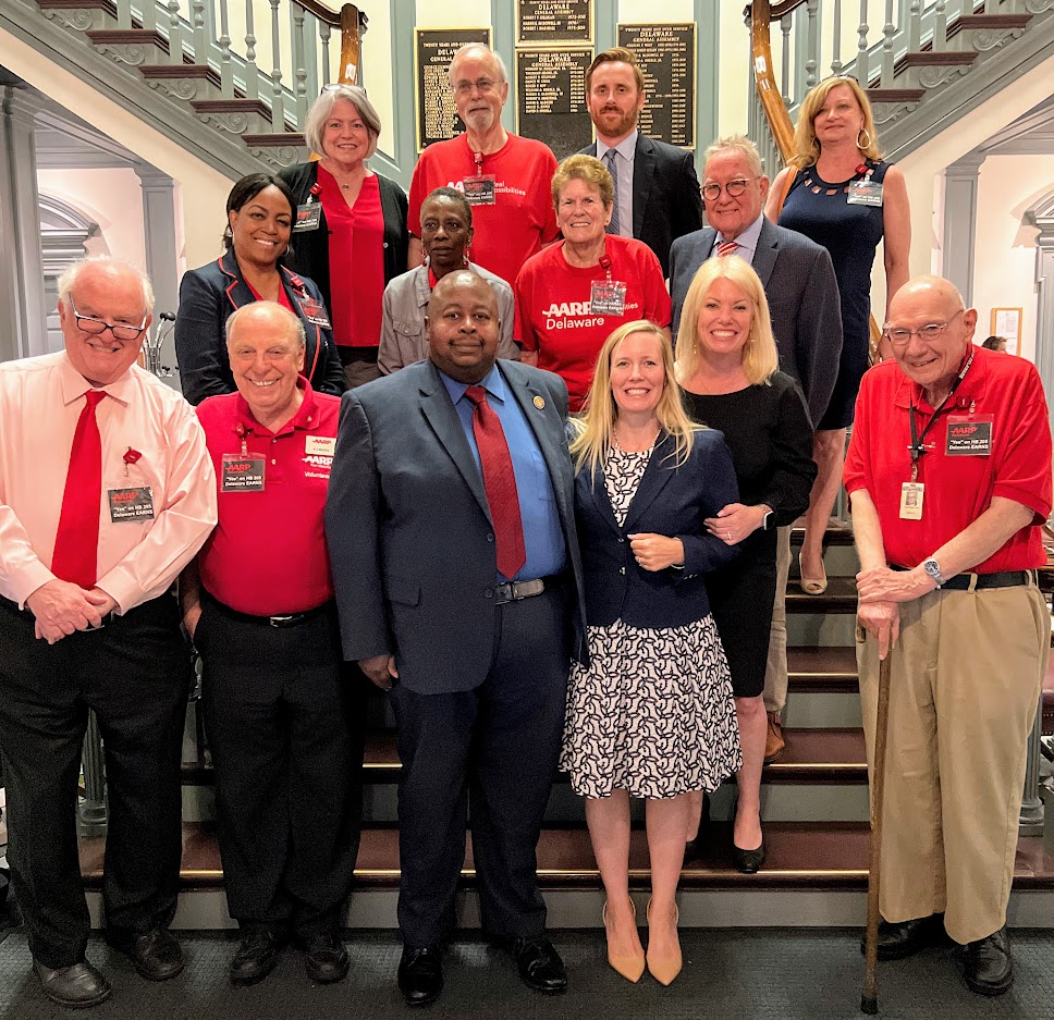 DE EARNS sponsors & state treasurer with AARP volunteers on Legislative Hall steps after bill passed