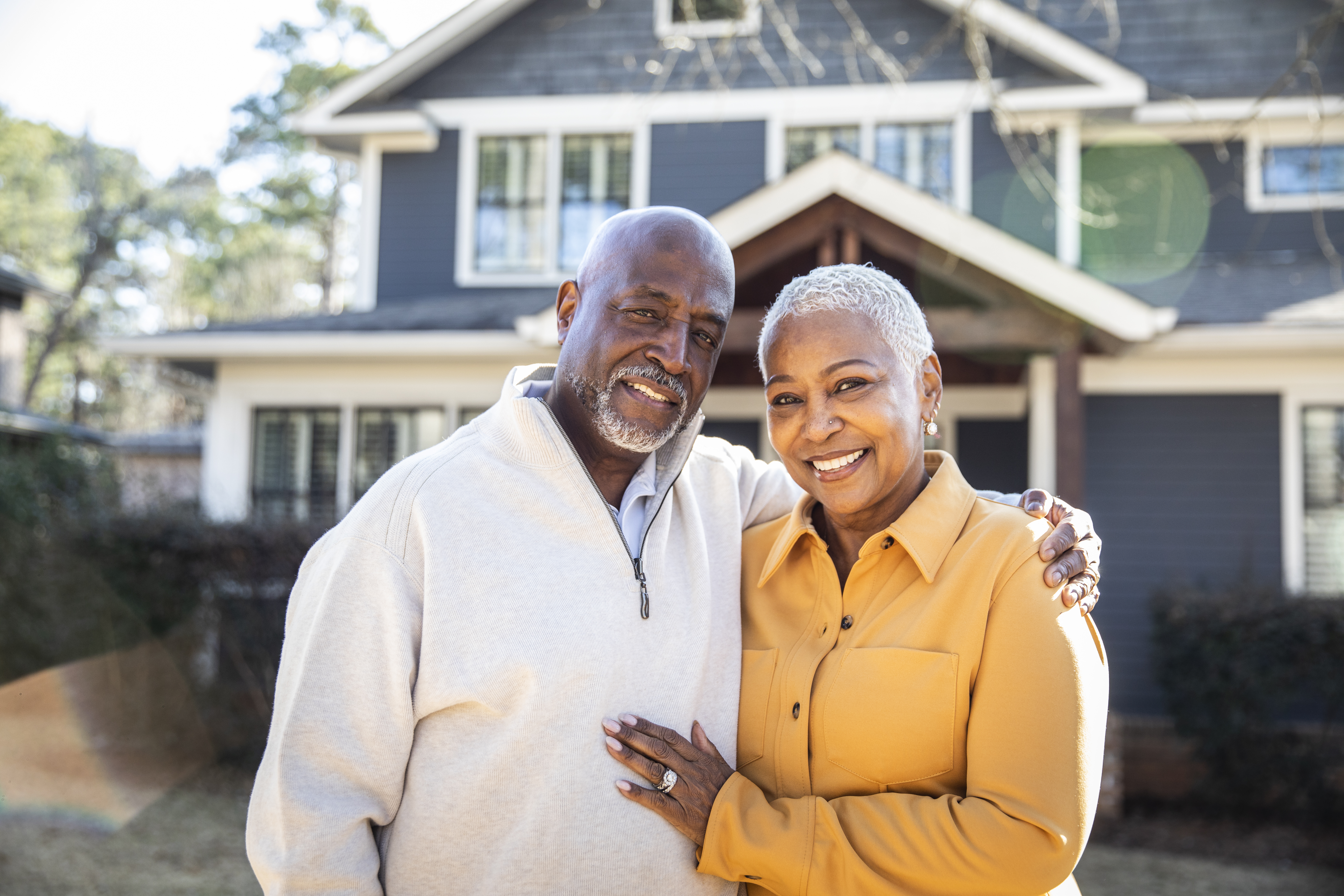 Couple outside a home